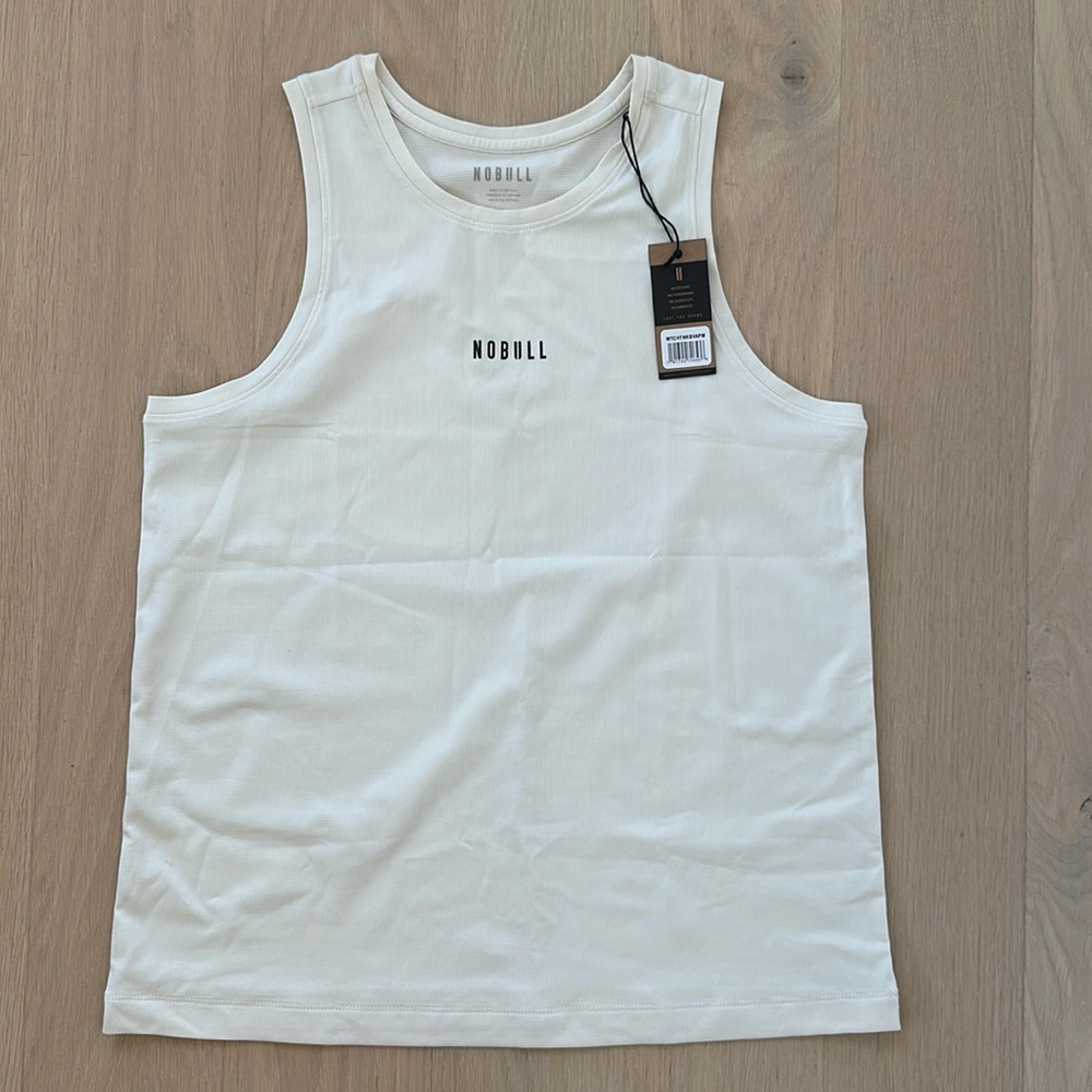 NOBULL women’s delta peak tank white vapor which is cream medium new with tags.